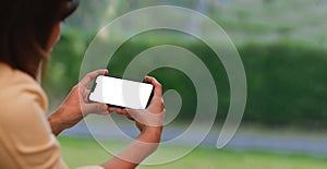 Young woman using smartphone at home. Student girl texting on mobile phone in her room.