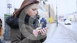 Young Woman Using Smartphone Standing on Street