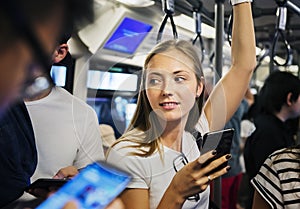 Young woman using a smartphone in the subway