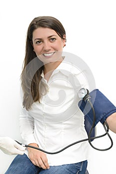 Young woman using a sphygmomanometer