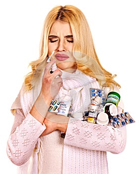 Young woman using throat spray.
