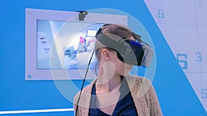 Young woman using virtual reality headset