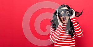 Young woman using virtual reality headset