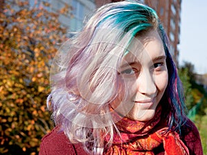 Young woman with varicolored streaks hair