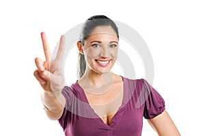 Young woman with victory sign
