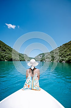 Young woman view to the cliffy rocks of Verdon Gorge at lake of Sainte Croix, Provence, France, near Moustiers Sainte