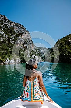 Young woman view to the cliffy rocks of Verdon Gorge at lake of Sainte Croix, Provence, France, near Moustiers Sainte