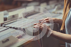 Young woman in a vinyl record store