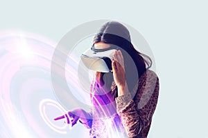 Young woman with virtual reality glasses. Modern technologies. The concept of future technology.