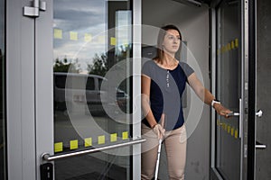 Young woman with vision impairment walking on city streets