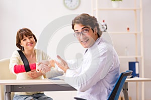 The young woman visiting doctor traumatologist