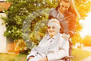 Young woman visiting grandmother in nursing home photo