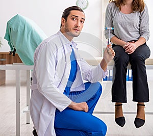 Young woman visiting male doctor neurologist