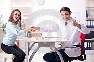 Young woman visiting male doctor oculist