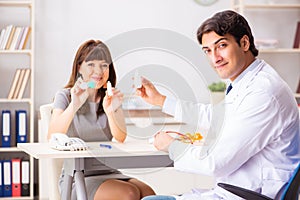 The young woman visiting male doctor ophthalmologist in hospital