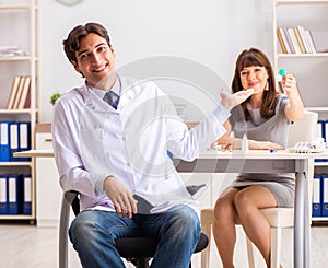 Young woman visiting male doctor ophthalmologist in hospital