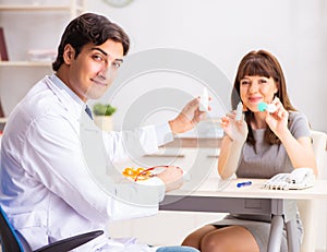 Young woman visiting male doctor ophthalmologist in hospital