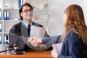 The young woman visiting male lawyer