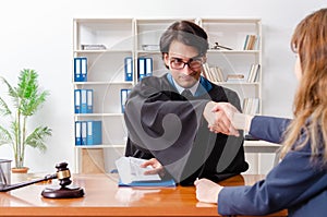 The young woman visiting male lawyer