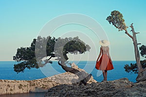 Young woman waiting for sailboat