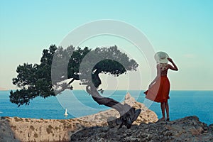 Young woman waiting for sailboat