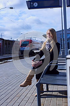 Young woman waiting train