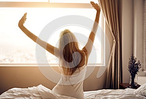 Young woman wake up in bedroom.