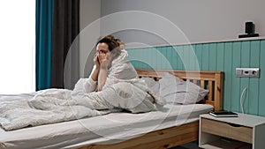 Young Woman Waking Up in a Cozy Bedroom at Daybreak