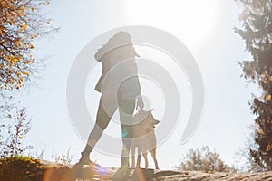 Young woman on a walk with her dog breed Akita inu.