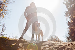 Young woman on a walk with her dog breed Akita inu.