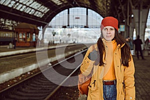 Woman walk by railway station photo