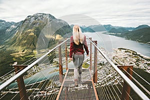 Young woman walking alone on Rampestreken viewpoint