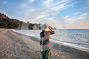 Young woman walking on the beach, Cala del CaÃÂ±uelo, Andalusia