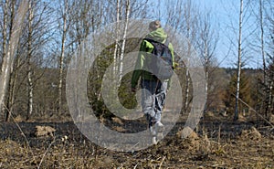Young woman walking in coppice photo