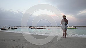 Young woman walking in the Gili Trawangan beach