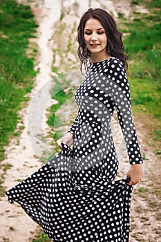 Young woman walking on hill