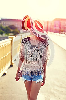 Young woman walking on margaret bridge budapest in sunset