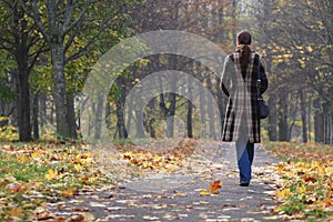 Young woman walking in park