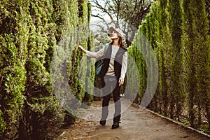 Young woman walking in the park labyrinth