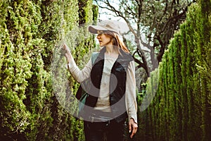 Young woman walking in the park labyrinth