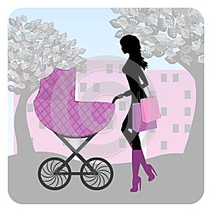 Young woman walking in park with stroller