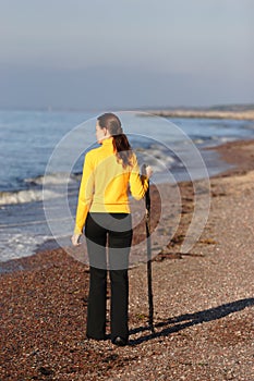 Young woman walking on a seaside