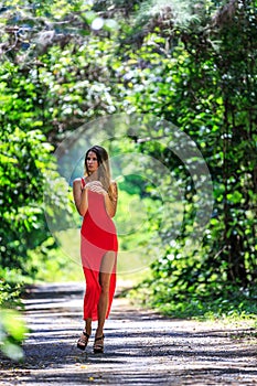 Young Woman Walking on The Tropical Road