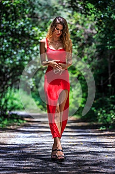 Young Woman Walking on The Tropical Road