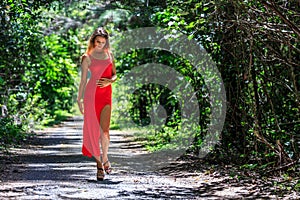 Young Woman Walking on The Tropical Road