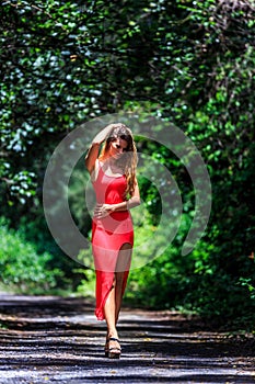 Young Woman Walking on The Tropical Road