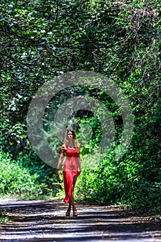 Young Woman Walking on The Tropical Road