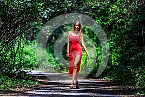 Young Woman Walking on The Tropical Road