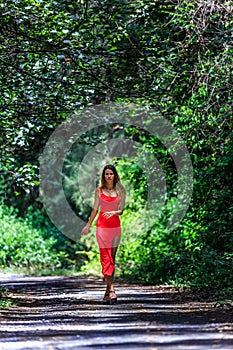 Young Woman Walking on The Tropical Road