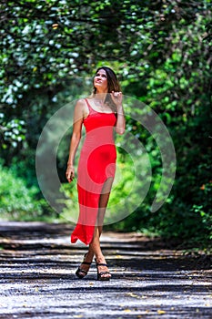 Young Woman Walking on The Tropical Road